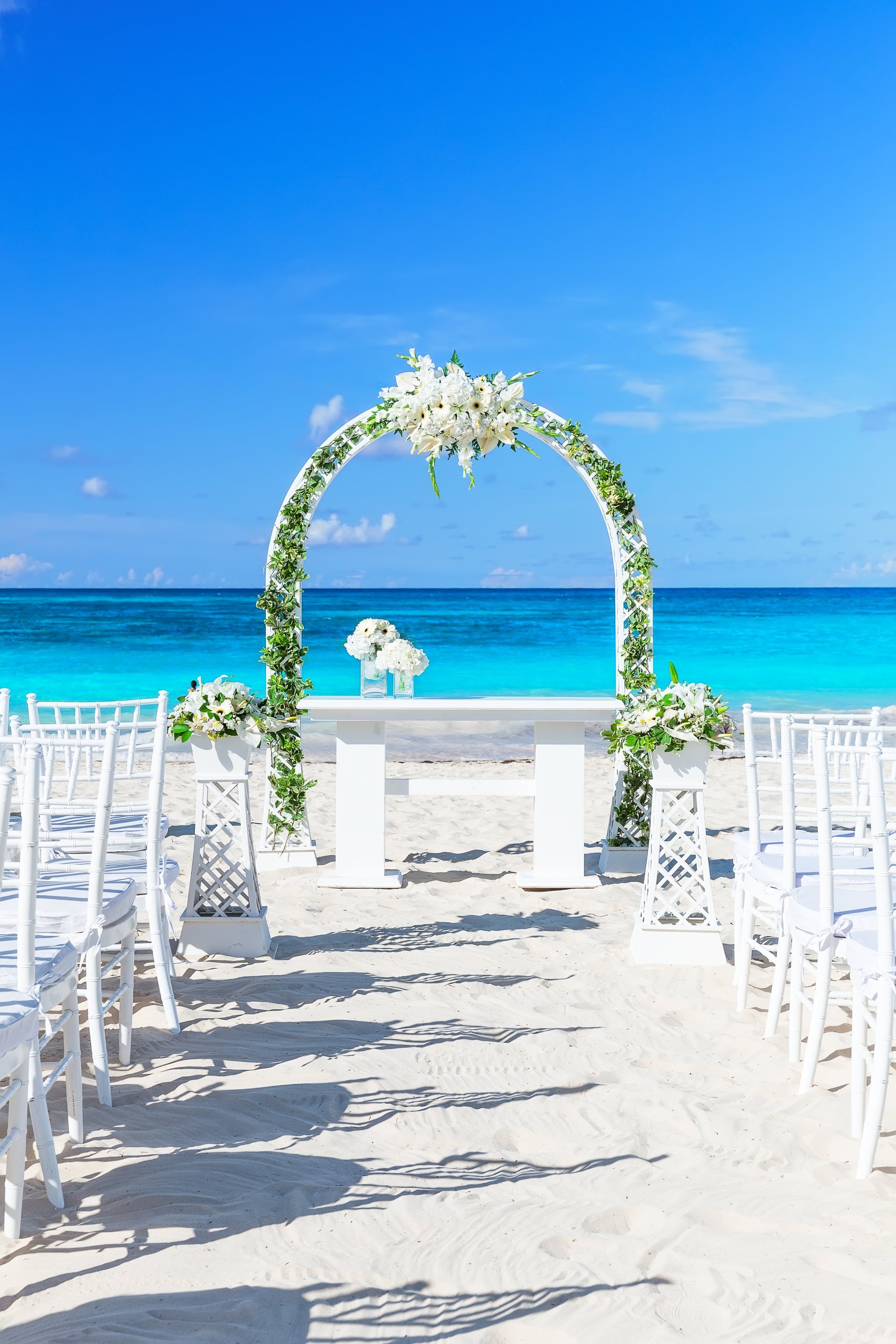 Tropical paradise wedding setting and beautiful wedding arch on the beach